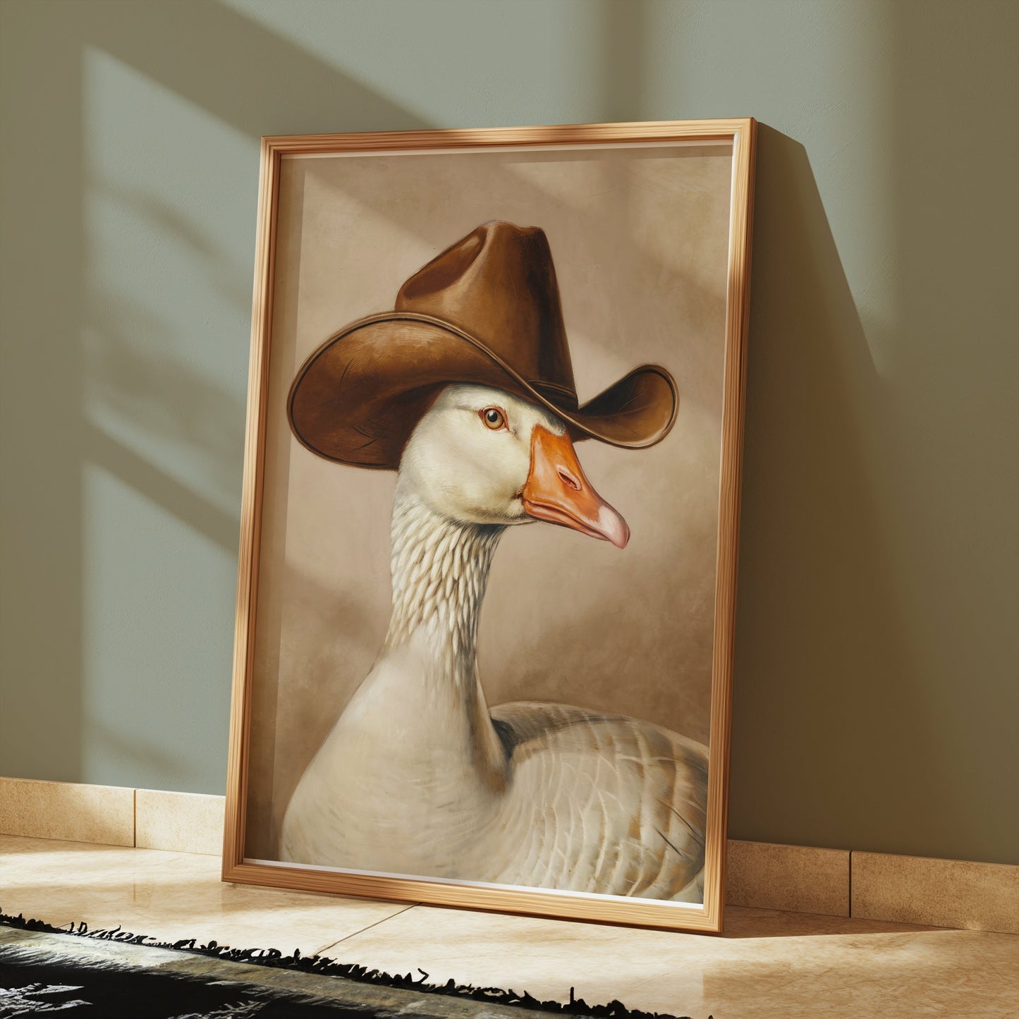 Goose wearing cowboy hat art print framed and placed on a tiled floor, offering a quirky and humorous decor option for any room.
