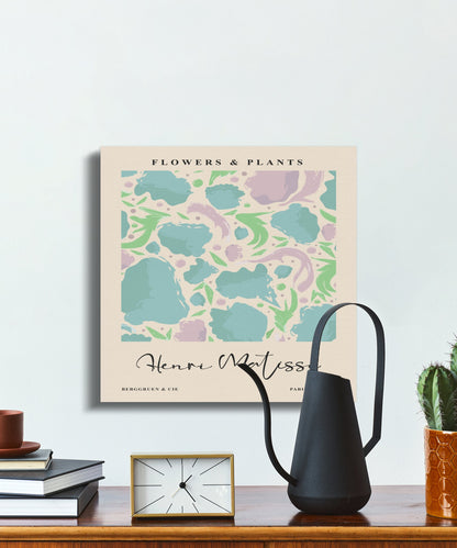 Henri Matisse Flowers and Plants canvas wrap on a minimalist desk with a black watering can and books, perfect for modern interiors.