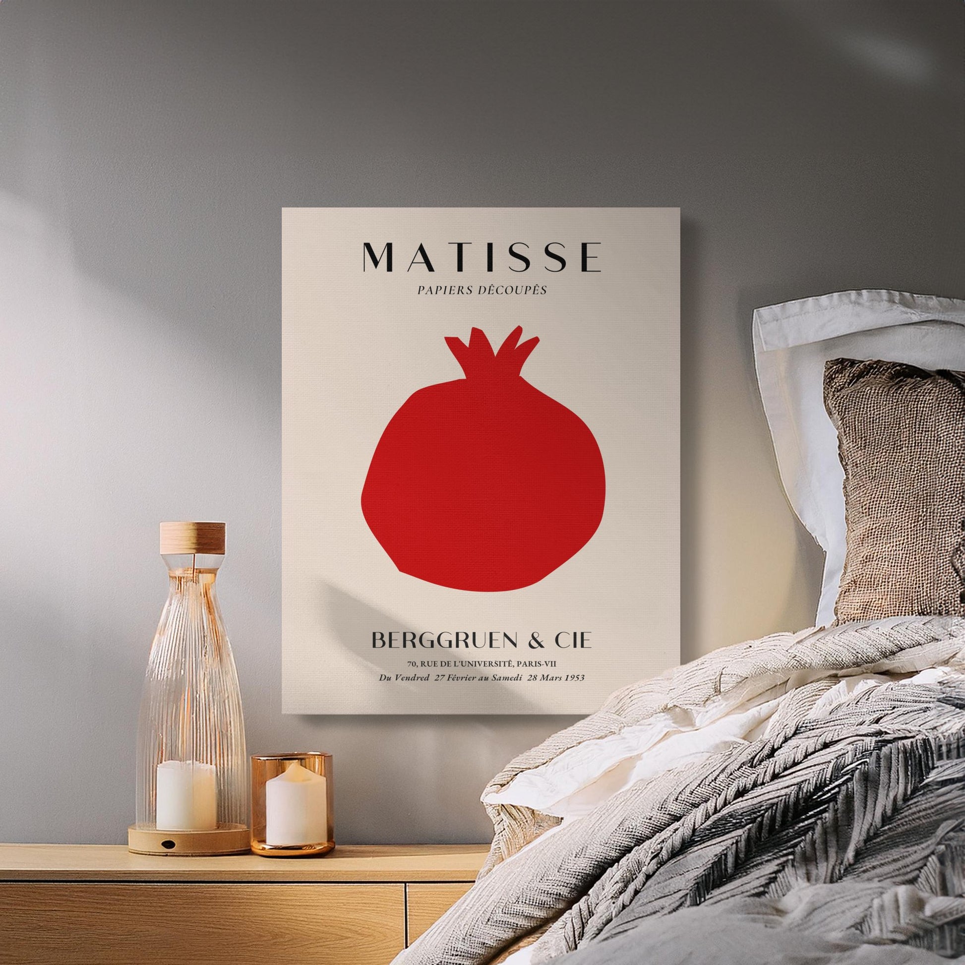 Henri Matisse inspired Berggruen and Cie canvas wrap hanging in a cozy bedroom setting with candles and neutral bedding.