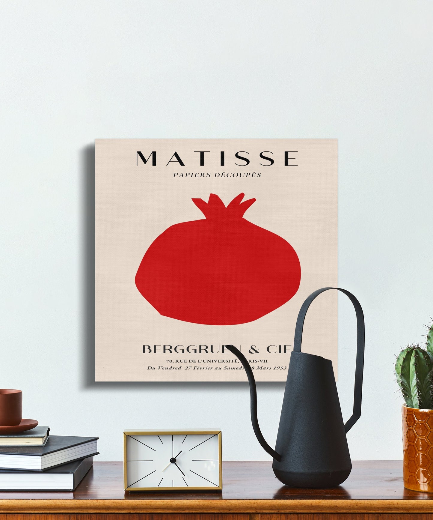 Henri Matisse inspired Berggruen and Cie canvas wrap on a white wall, paired with a black watering can and modern shelf décor.
