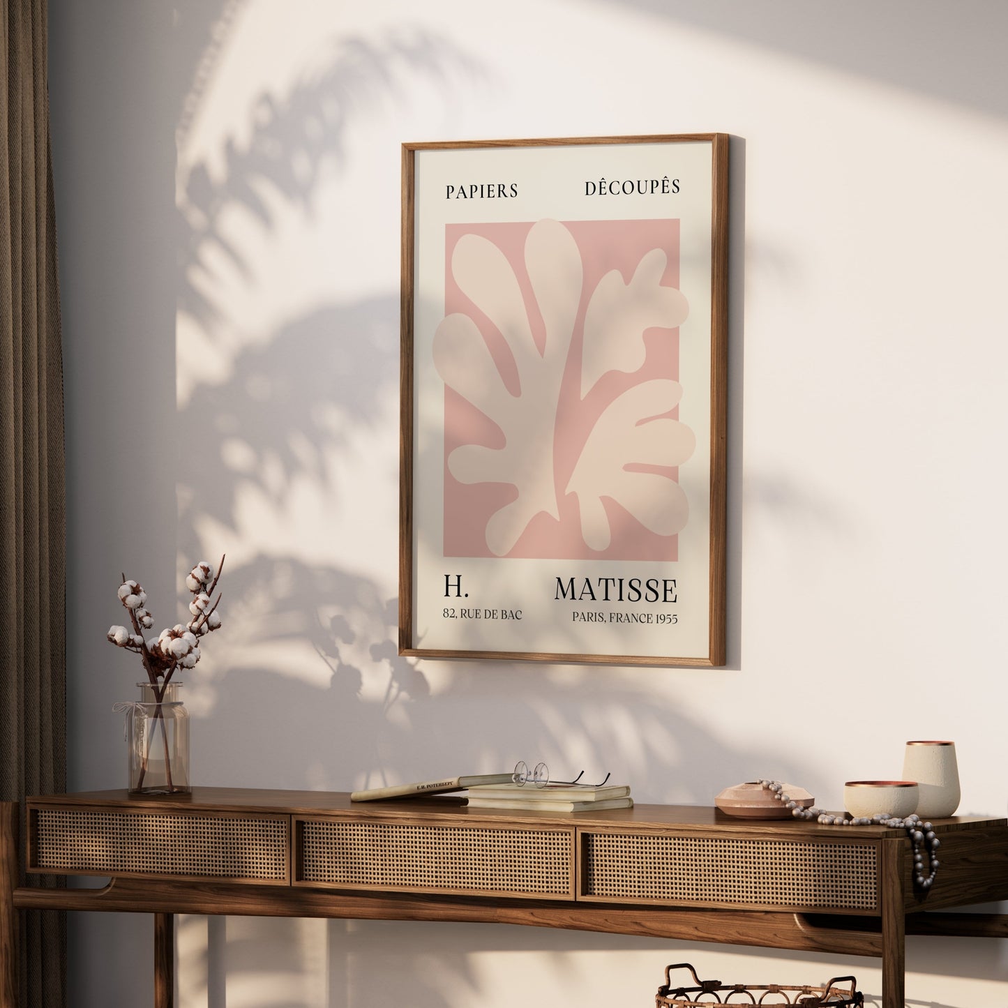Framed Henri Matisse inspired Papiers Decoupes art print poster displayed on a wooden console table in a modern home decor setting.