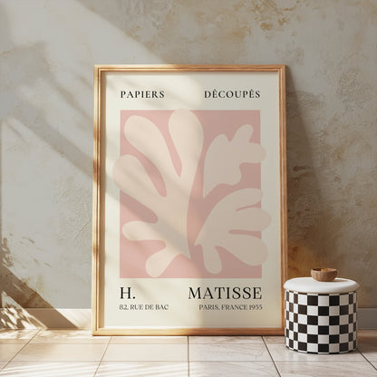Henri Matisse inspired Papiers Decoupes art print poster in a wooden frame, leaning against a textured wall with soft natural lighting.