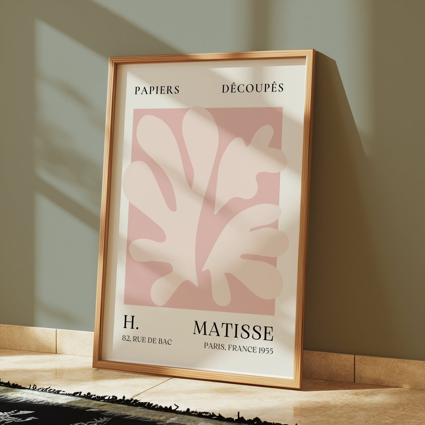 Henri Matisse inspired Papiers Decoupes art print poster in a wooden frame, placed on a tiled floor with soft shadows and modern decor.