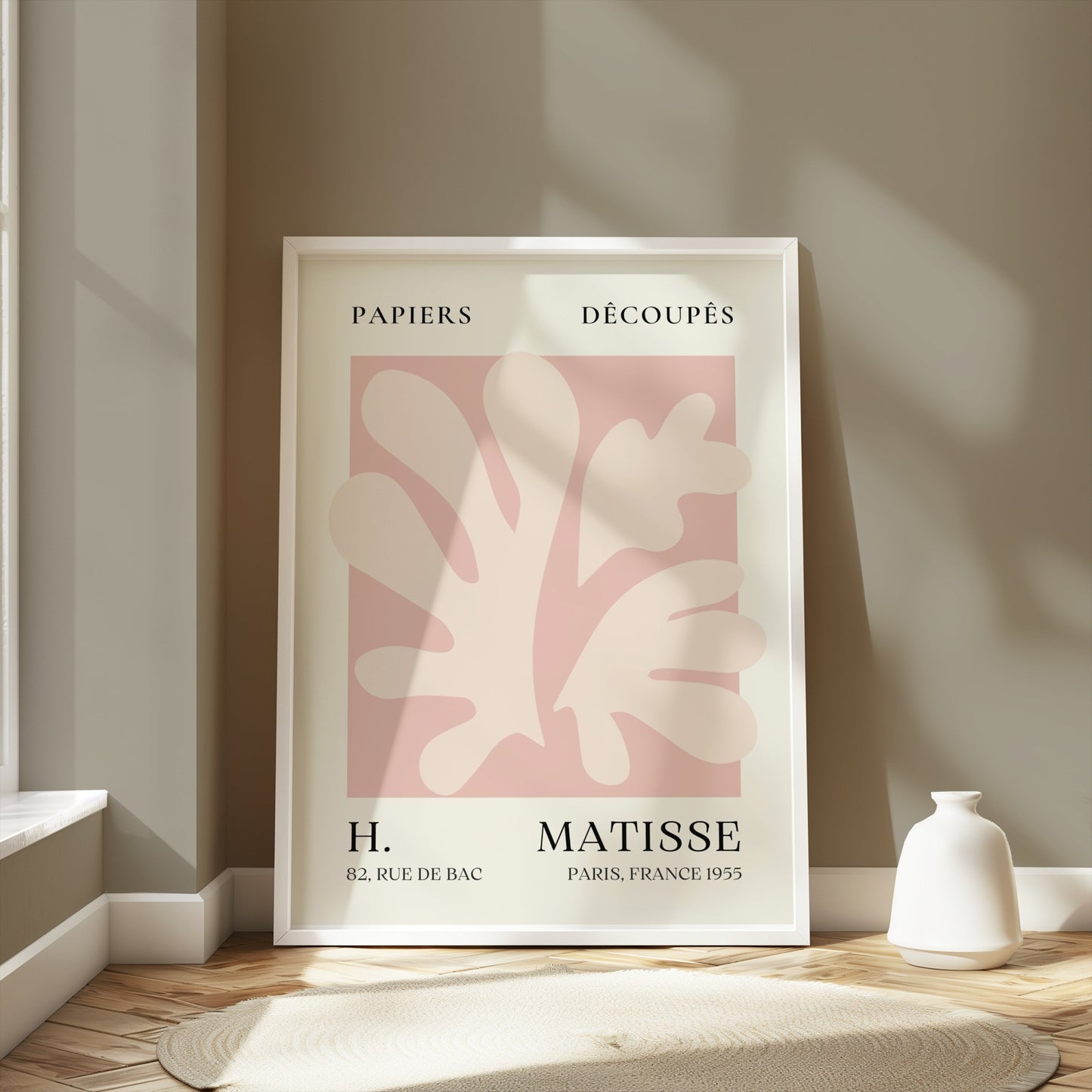 Henri Matisse inspired Papiers Decoupes art print poster in a white frame, leaning against a neutral wall with sunlight and minimalist decor.