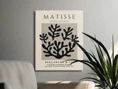 Modern Henri Matisse inspired wall art with coral design on canvas wrap, displayed in a living room with minimalist furniture and greenery.