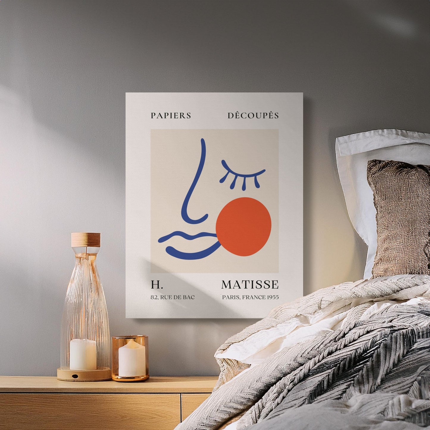 Henri Matisse Papiers Decoupes canvas wrap hung above a bed, creating a chic and artsy bedroom aesthetic with modern wall art.