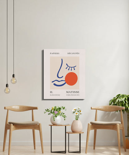 Henri Matisse Papiers Decoupes canvas wrap in a modern sitting area with wooden chairs and plants, perfect for Paris-inspired wall decor.