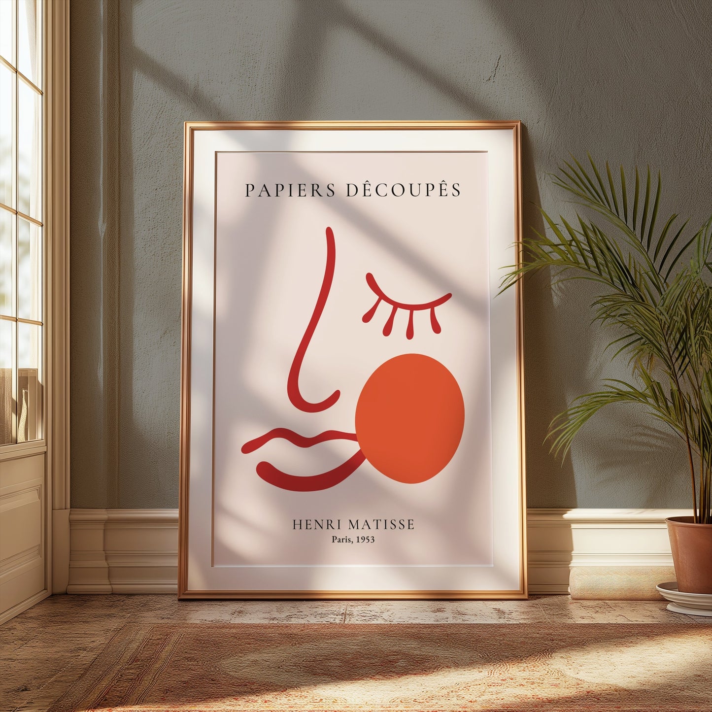 Henri Matisse Papiers Decoupes Paris 1953 art poster in a wooden frame, styled in a cozy room with natural light and green accents.
