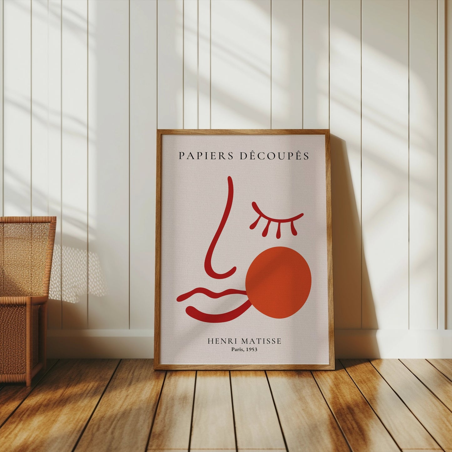 Henri Matisse Papiers Decoupes Paris 1953 art poster in a wooden frame, styled in a bright room with wooden flooring and natural light.
