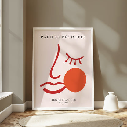 Henri Matisse Papiers Decoupes Paris 1953 art poster in a white frame, styled in a modern room with soft lighting and neutral decor.