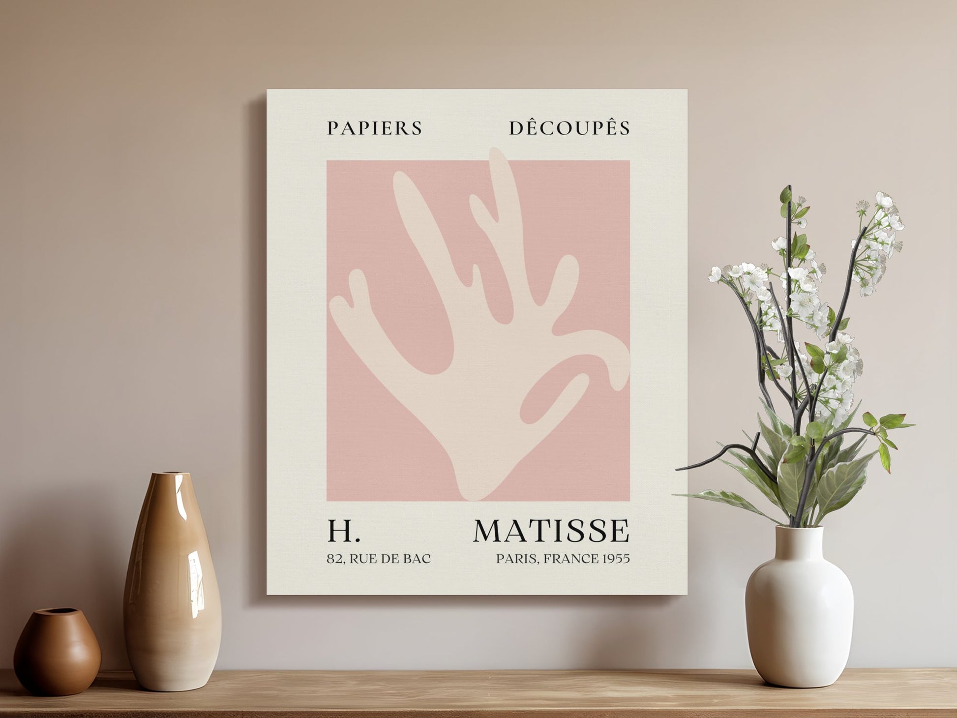 Henri Matisse Papiers Decoupes canvas wrap displayed in a modern living room with vases and flowers, adding artistic decor to the space.