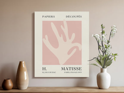 Henri Matisse Papiers Decoupes canvas wrap displayed in a modern living room with vases and flowers, adding artistic decor to the space.