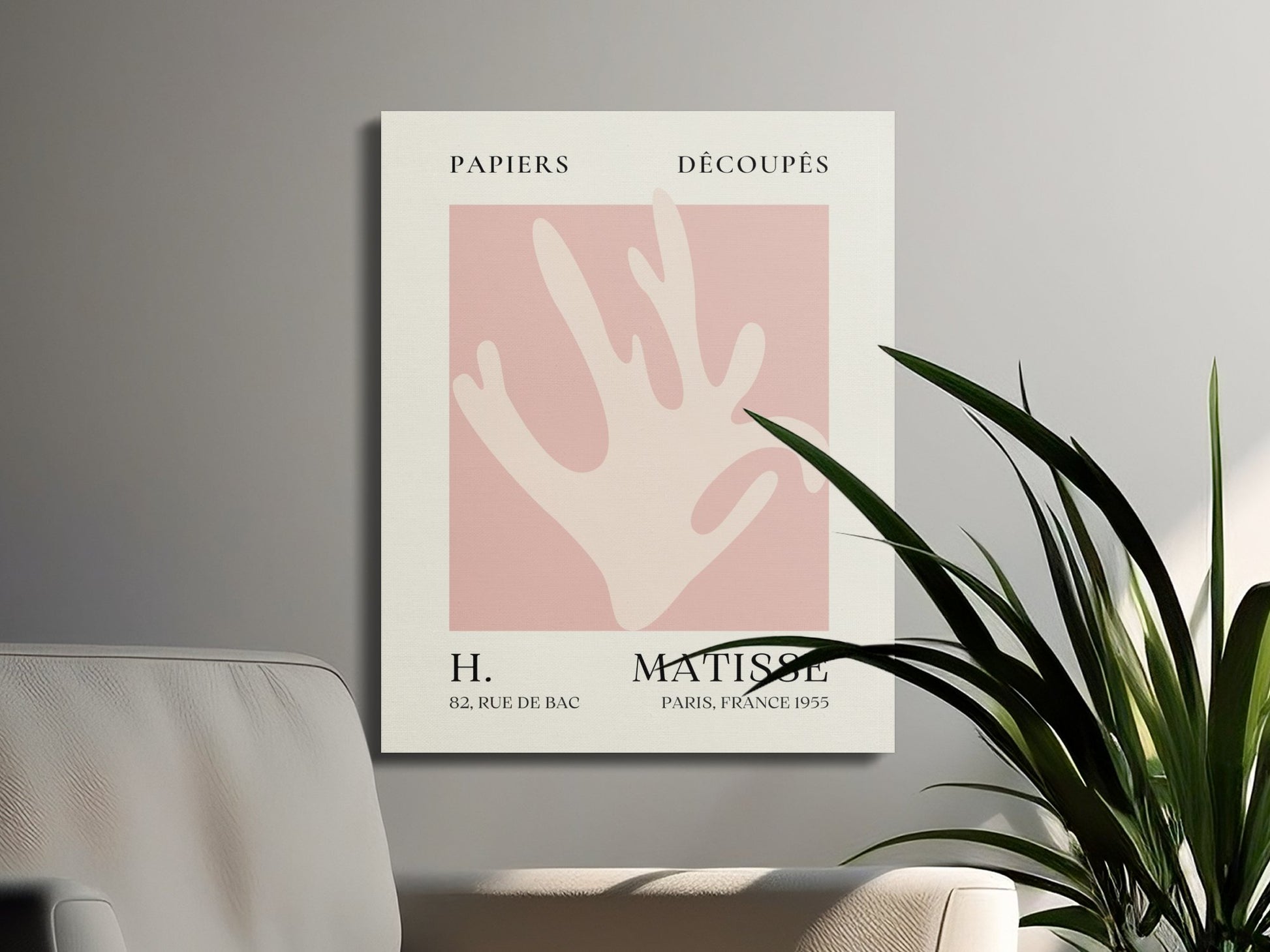 Henri Matisse Papiers Decoupes wall art canvas wrap styled in a contemporary setting with a gray wall and green plants for modern home decor.