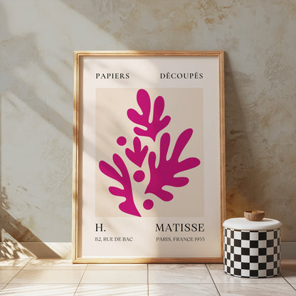 Henri Matisse Paris France 1955 Papiers Découpés poster in a wooden frame leaning against a textured wall, styled with minimalist decor.