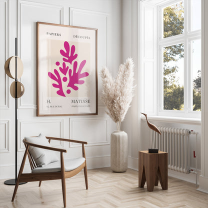 Henri Matisse Paris France 1955 Papiers Découpés poster framed and hung in a bright, modern living room with neutral tones and elegant furniture.