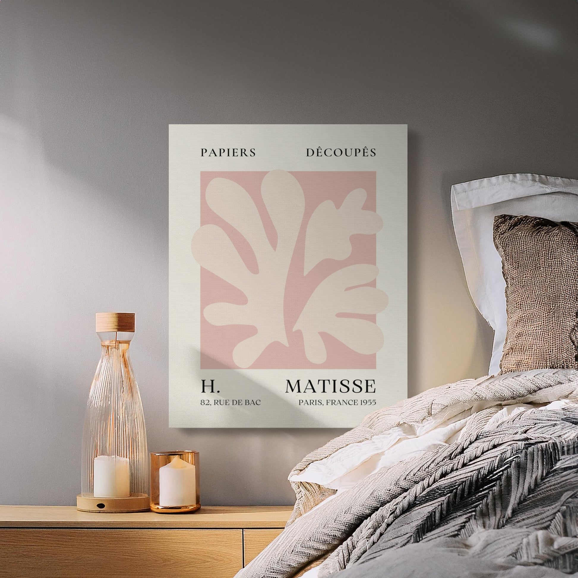 Henri Matisse reproduction canvas wrap hung above a cozy bedside table with candles, adding timeless art to bedroom decor.