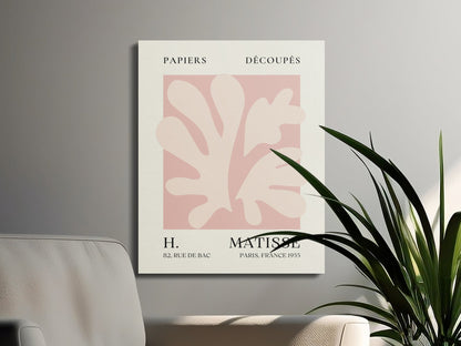 Henri Matisse reproduction canvas wrap on a gray wall with green plants and a beige chair, enhancing modern interior design aesthetics.