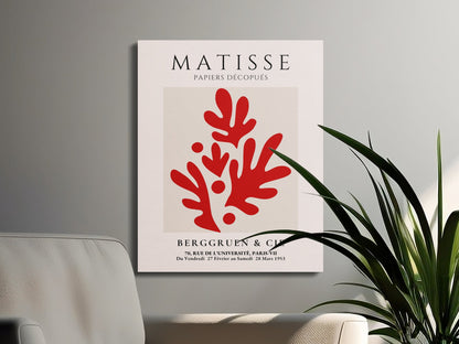 Henri Matisse Papiers Decoupes canvas art with red abstract design, displayed in a modern living space with plants and neutral tones.