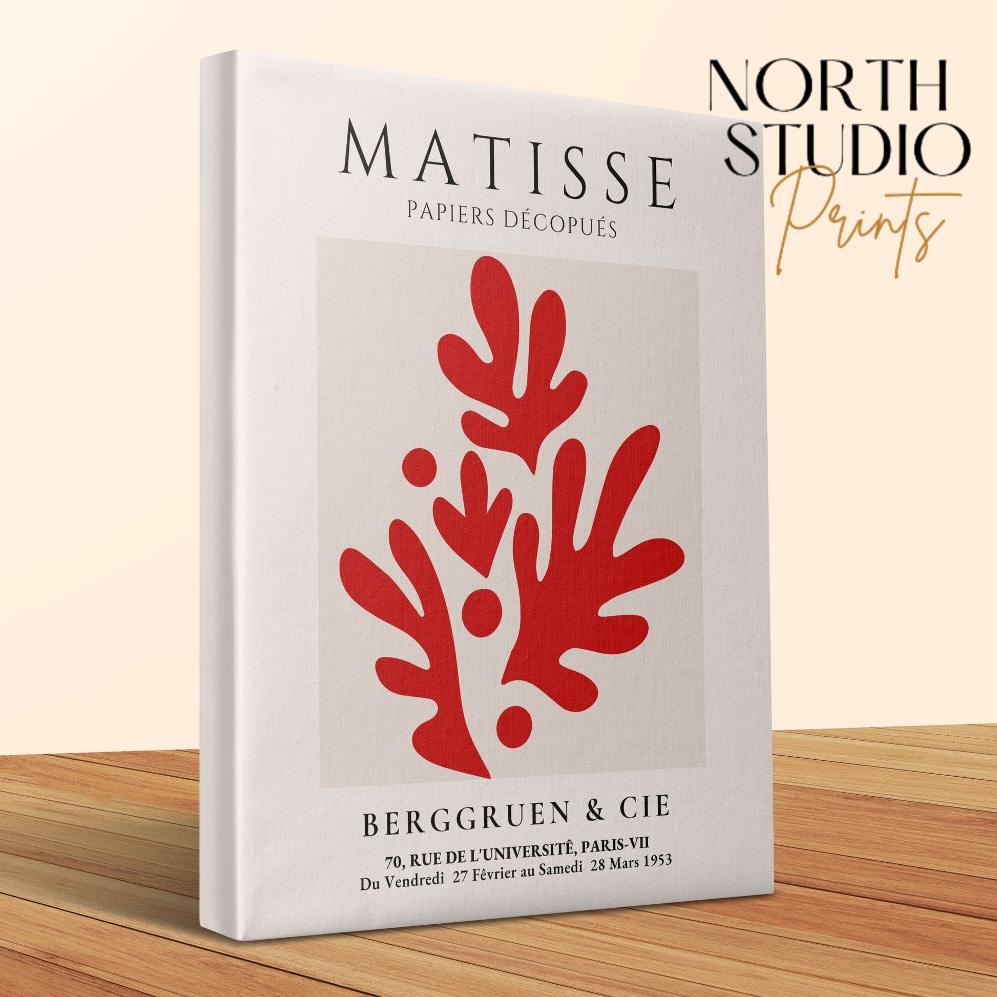Henri Matisse Papiers Decoupes canvas wrap with bold red abstract design, displayed on a wooden surface with North Studio Prints branding.