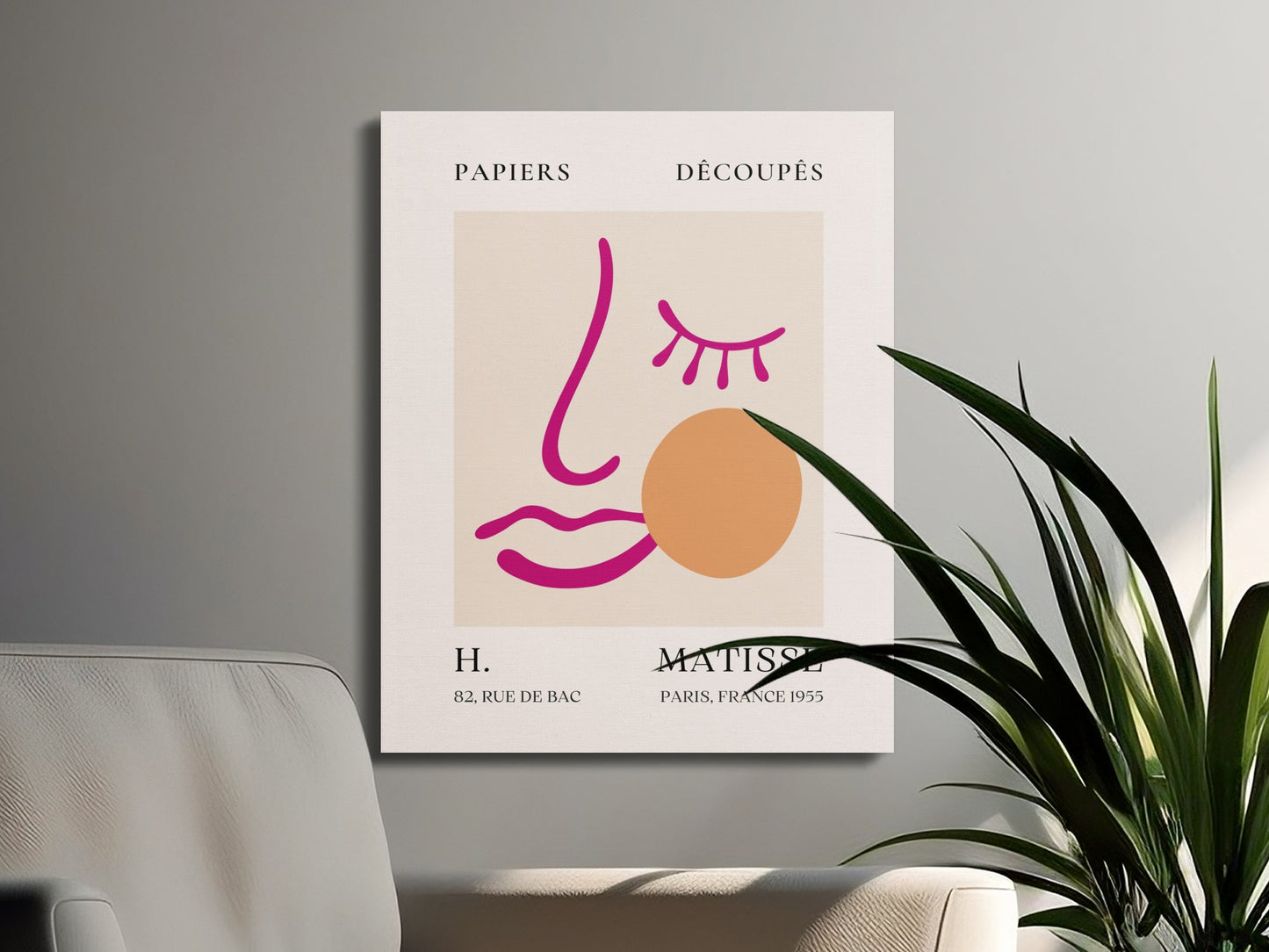 Henri Matisse canvas wrap with minimalist face design, styled on a wall next to a plant and modern furniture for home decor.