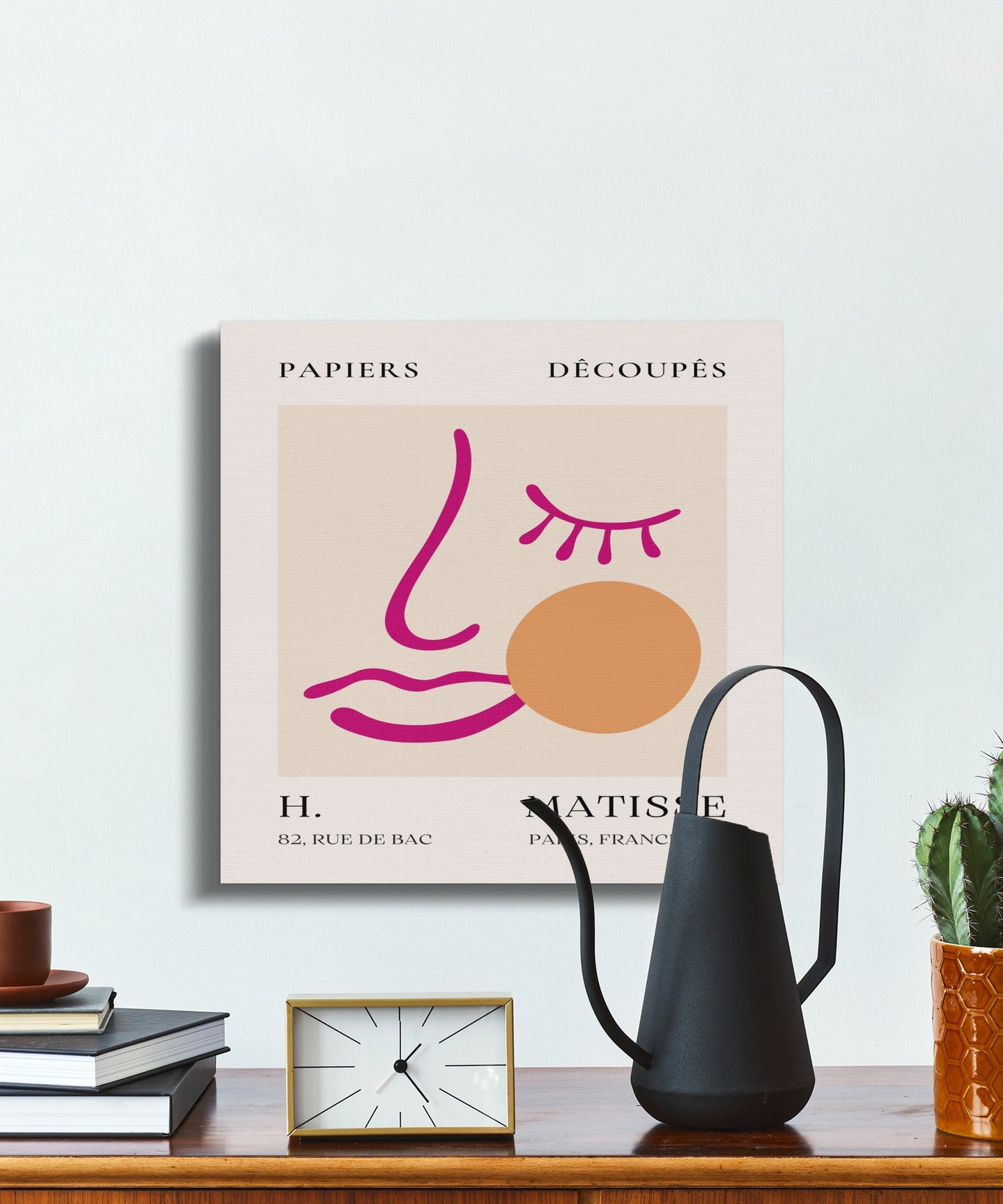 Henri Matisse wall art displayed on a shelf with a watering can and clock, featuring a minimalist design and 'Papiers Decoupes' text.