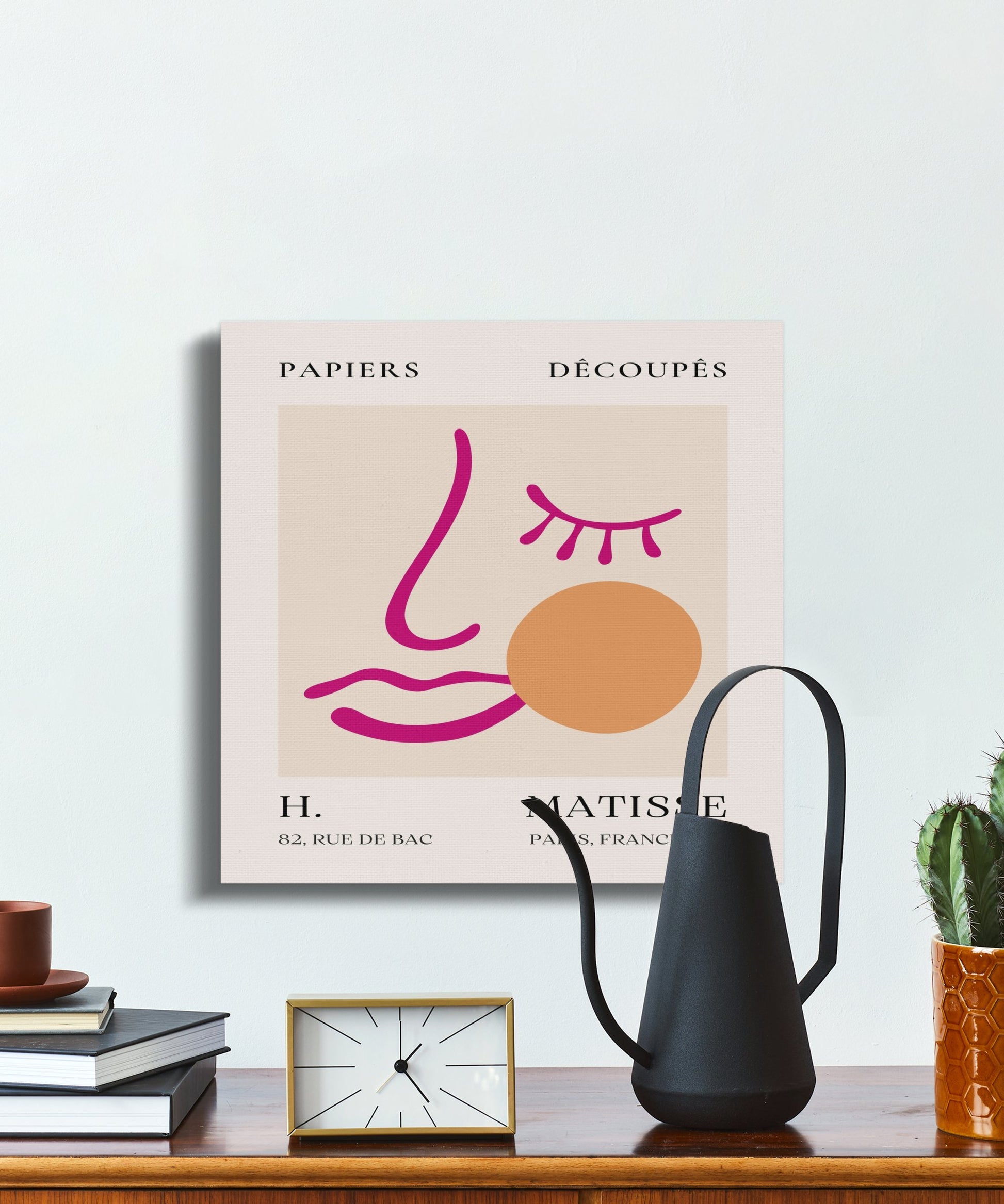 Henri Matisse wall art displayed on a shelf with a watering can and clock, featuring a minimalist design and 'Papiers Decoupes' text.