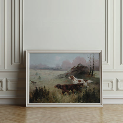 Hunting dogs in misty forest landscape poster in a white frame, leaning against an ornate wall in a classic interior.