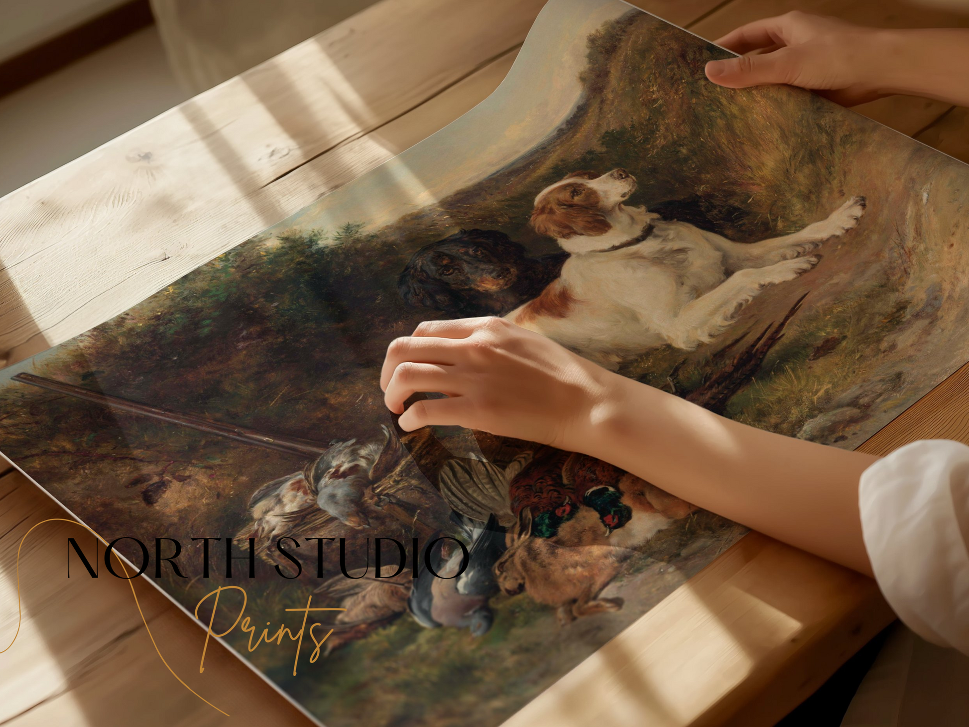 Hands holding a rolled hunting dogs artwork print, showcasing detailed countryside art perfect for rustic and outdoor life decor.