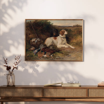 Framed hunting dogs artwork displayed on a wooden console table, ideal for rustic decor and countryside-inspired interiors.