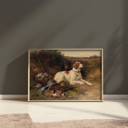 Framed countryside hunting scene artwork featuring dogs and game birds, displayed against a dark green wall with natural light.