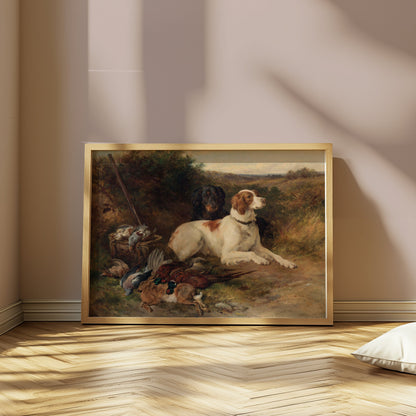 Rustic hunting dogs artwork in a wooden frame, propped against a wall in a softly lit room with herringbone flooring.