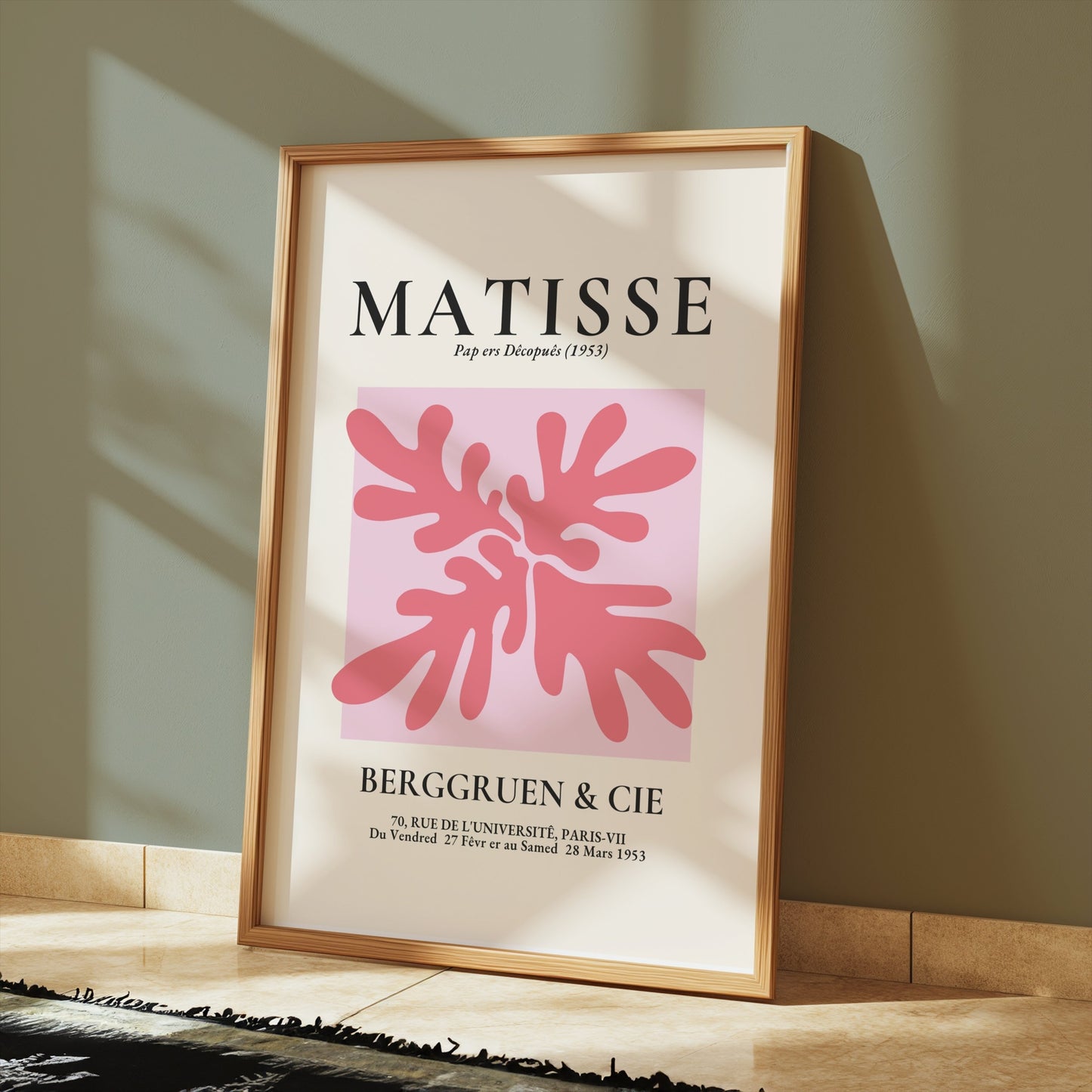 Matisse Art Exhibition Paris 1953 poster in a wooden frame, leaning against a wall with sunlight casting shadows.