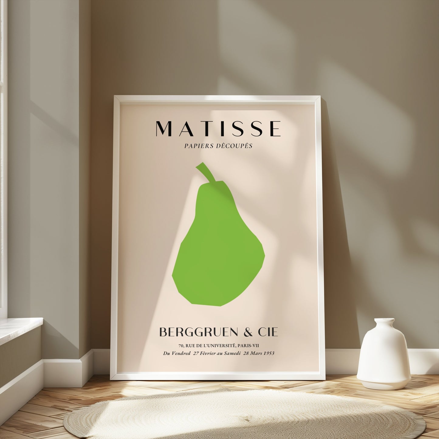 Matisse green pear poster in a white frame, styled in a modern room with soft lighting and neutral decor accents.