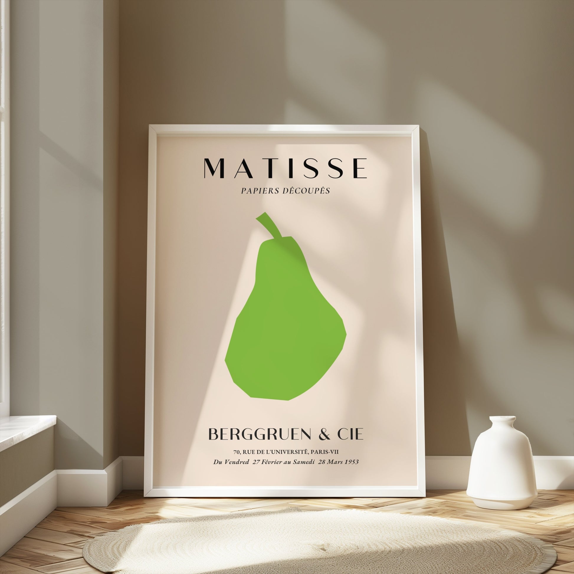 Matisse green pear poster in a white frame, styled in a modern room with soft lighting and neutral decor accents.