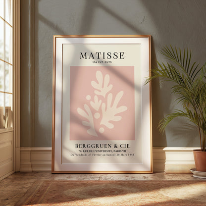 Framed Matisse Cut-Outs Berggruen & Cie Paris VII poster displayed in a sunlit room with elegant decor and natural light.
