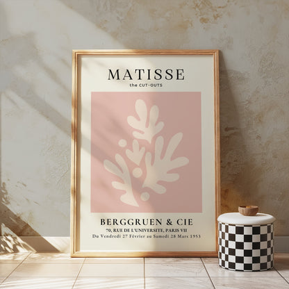 Matisse Cut-Outs Berggruen & Cie Paris VII poster in a wooden frame, styled against a textured wall with soft lighting.