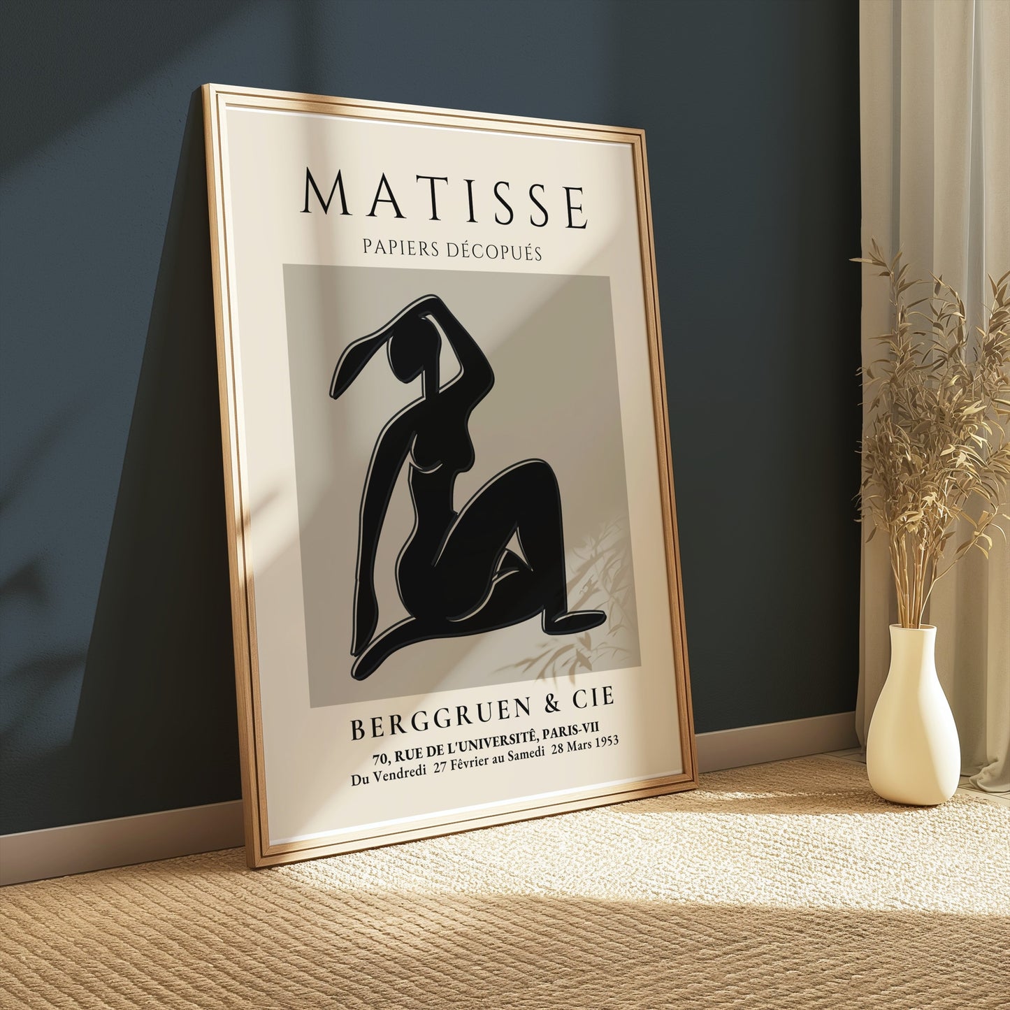 Framed Matisse Exhibition Papiers Decoupés Berggruen Poster leaning against a dark wall, perfect for contemporary home decoration.