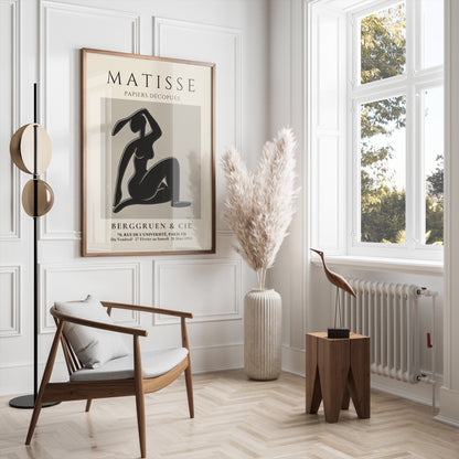 Matisse Exhibition Papiers Decoupés Berggruen Poster displayed in a bright, modern living room with minimalist furniture and decor.
