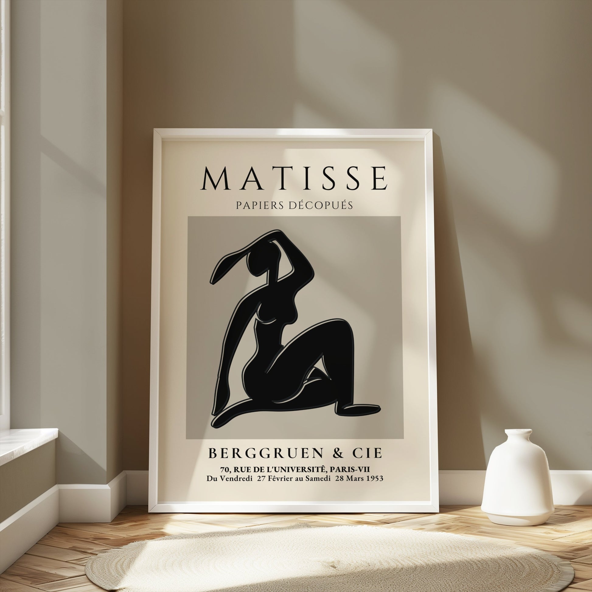 Framed Matisse Exhibition Papiers Decoupés Berggruen Poster styled in a light-filled room with minimalist decor and neutral tones.