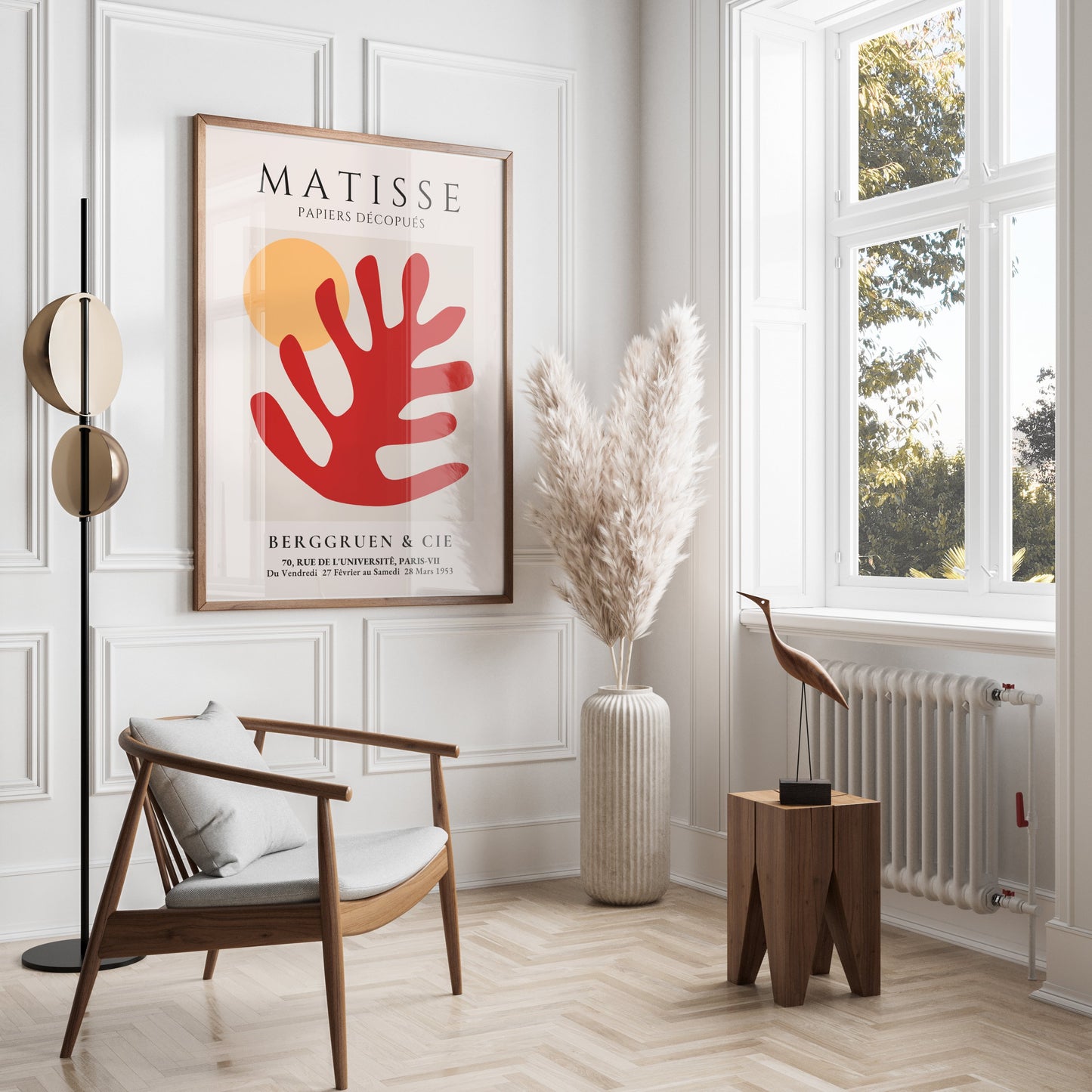 Framed Matisse Art Poster with red coral cut-out and orange sun, displayed in a modern living room with neutral tones and natural decor elements.