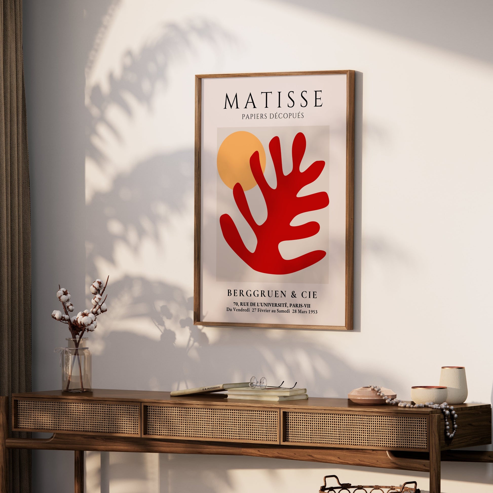 Framed Matisse Art Poster with red coral cut-out and orange sun, styled on a wooden console table with decorative accents in a cozy room.