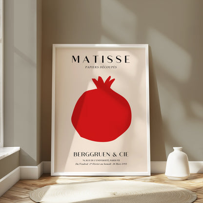 Matisse Papiers Decoupes Berggruen & Cie poster in a white frame leaning against a wall in a modern, neutral-toned room with soft lighting.