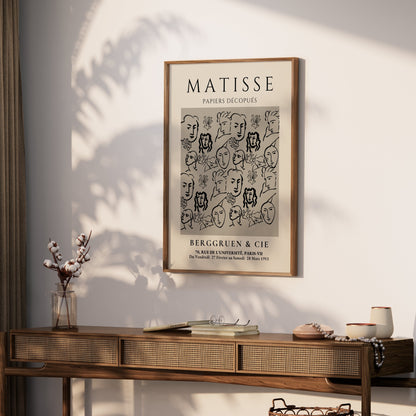 Framed Matisse Papiers Découpés exhibition poster displayed on a wooden console table with decor, perfect for modern home interiors.