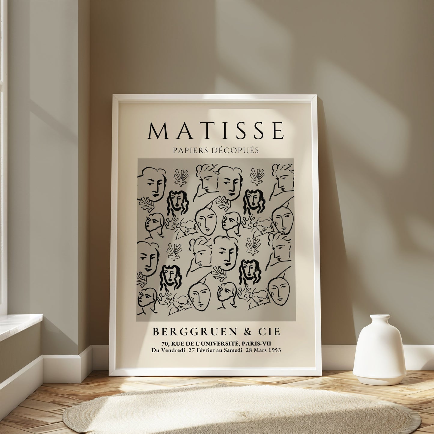 Matisse Papiers Découpés exhibition poster in a white frame, styled in a neutral-toned room with modern decor and natural light.