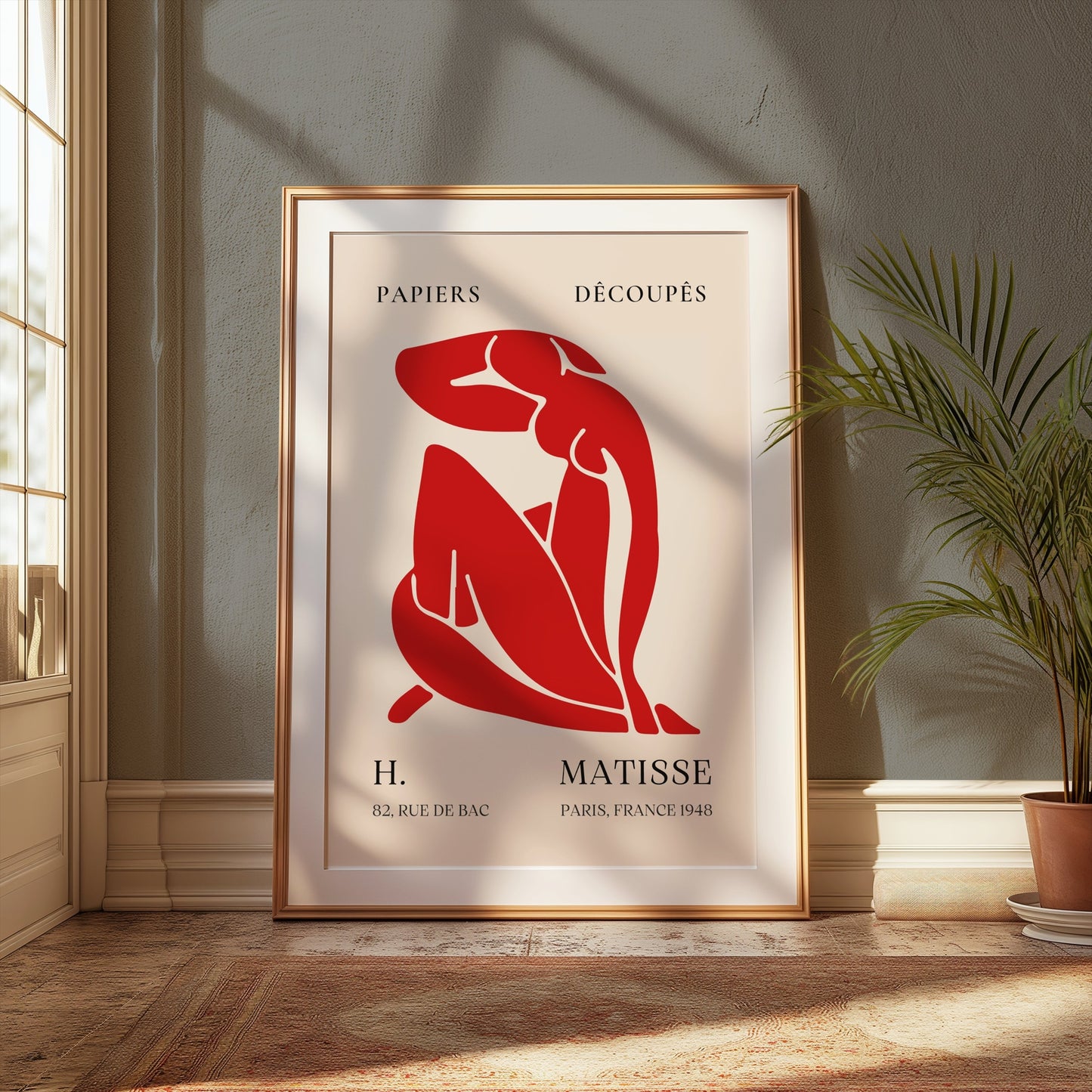 Henri Matisse 'Papiers Découpés' poster framed and styled in a sunlit room with green accents, perfect for modern wall decor.