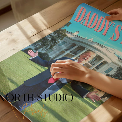 Close-up of hands holding the President Donald Trump Daddy's Home poster, showcasing its premium print quality and bold design for political satire fans.