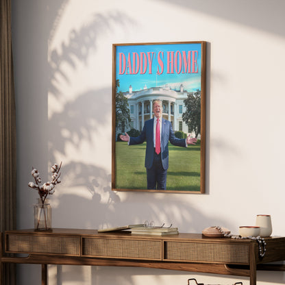 Framed President Donald Trump Daddy's Home poster hung on a wall above a wooden console table, creating a bold statement piece for any room.