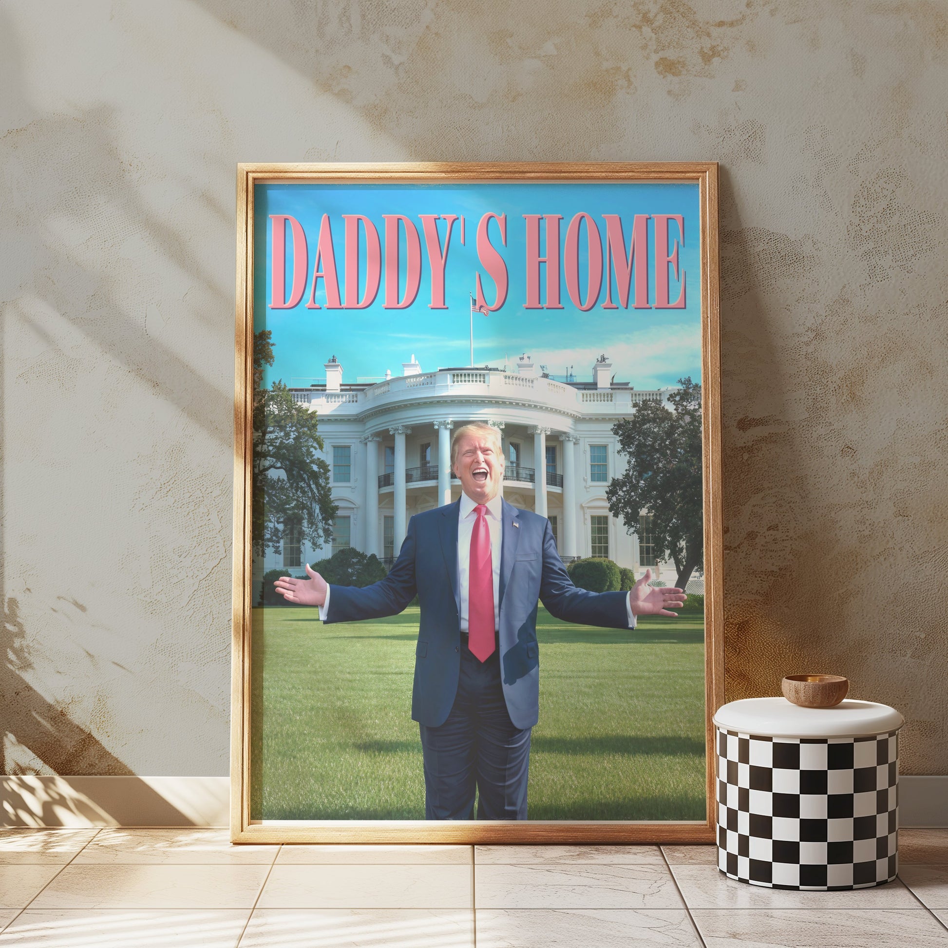 President Donald Trump Daddy's Home poster in a natural wood frame, leaning against a textured wall, adding a humorous and stylish touch to the decor.
