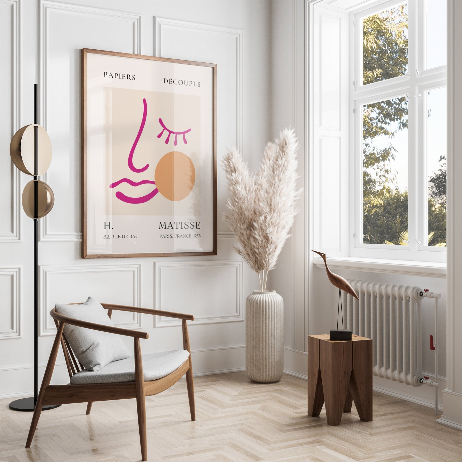 Framed abstract face art inspired by Matisse posters displayed in a stylish living room with neutral tones and pampas grass decor.