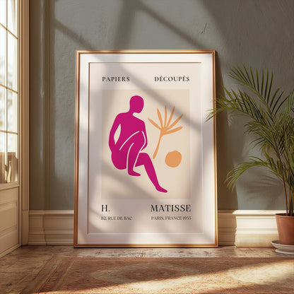 Henri Matisse inspired art print poster in a gold frame, leaning against a green wall with sunlight, ideal for modern wall decor.